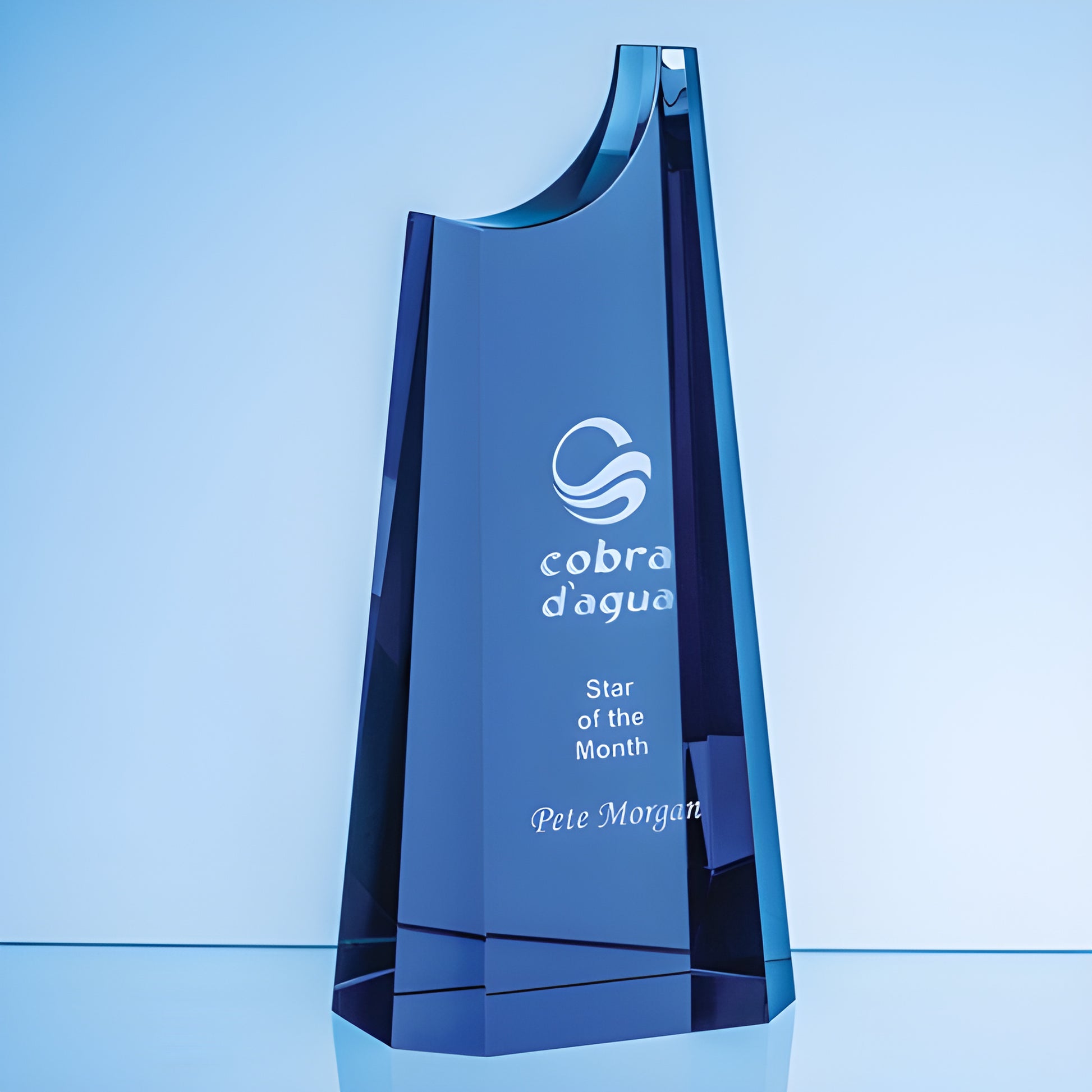 Cobalt blue crystal summit award etched with 'Star of the Month' and logo.