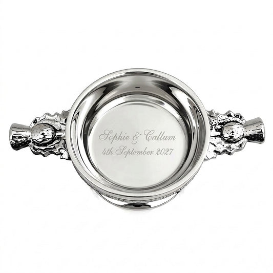 Example engraving (wedding): "Sophie & Callum / 4th September 2027" inside the 4" Thistle Handle Pewter Quaich Bowl