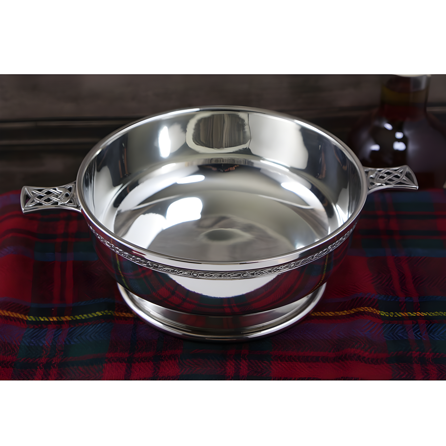 6.5-inch pewter quaich bowl with Celtic knot handles on tartan plaid