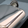 Close-up of a polished 6oz pewter hip flask with engraved detail.