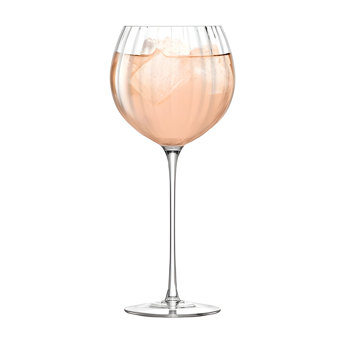 Elegant rose wine with ice cubes in a balloon glass.