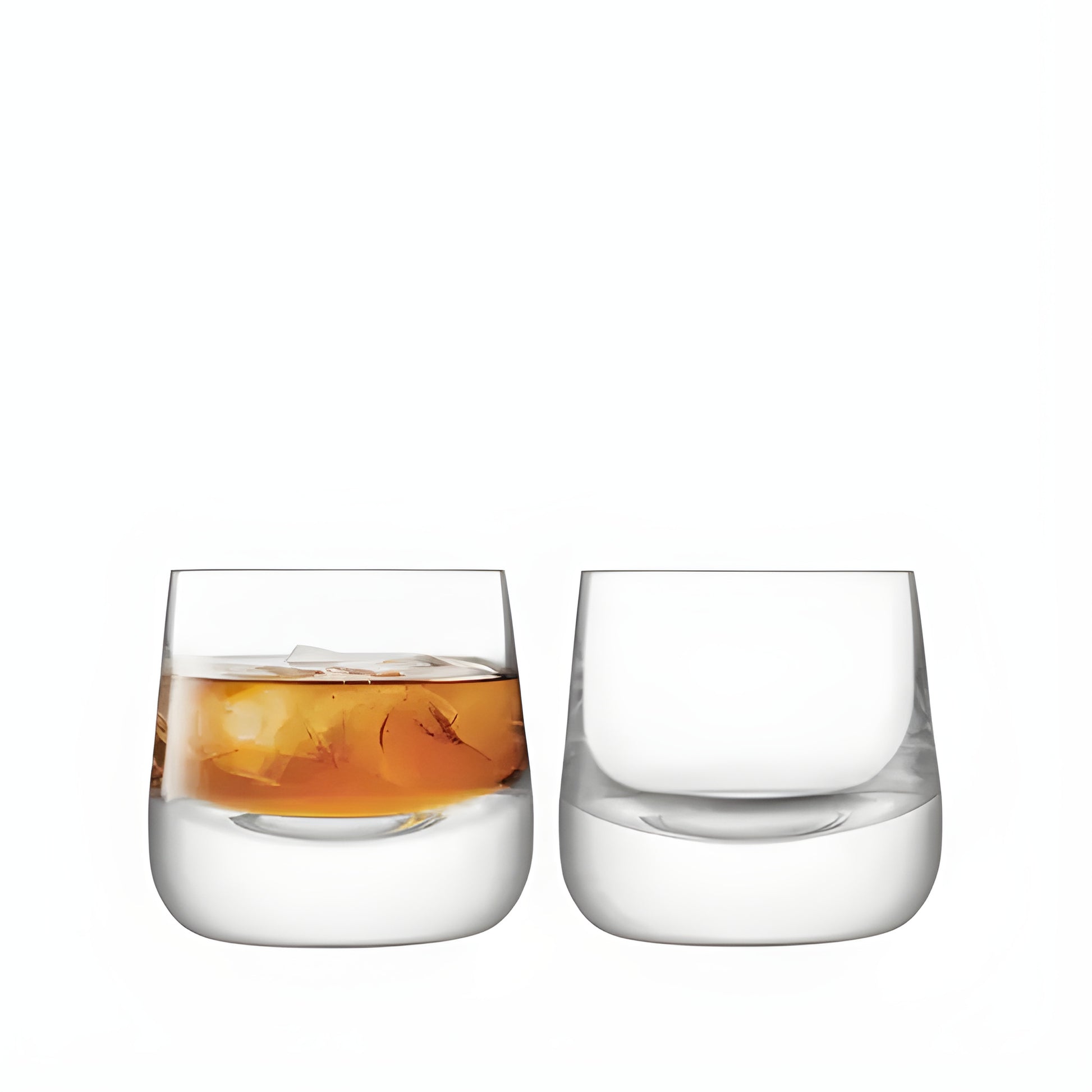 Modern set of 220ml whisky glasses, one filled with whisky and ice, on a white background.