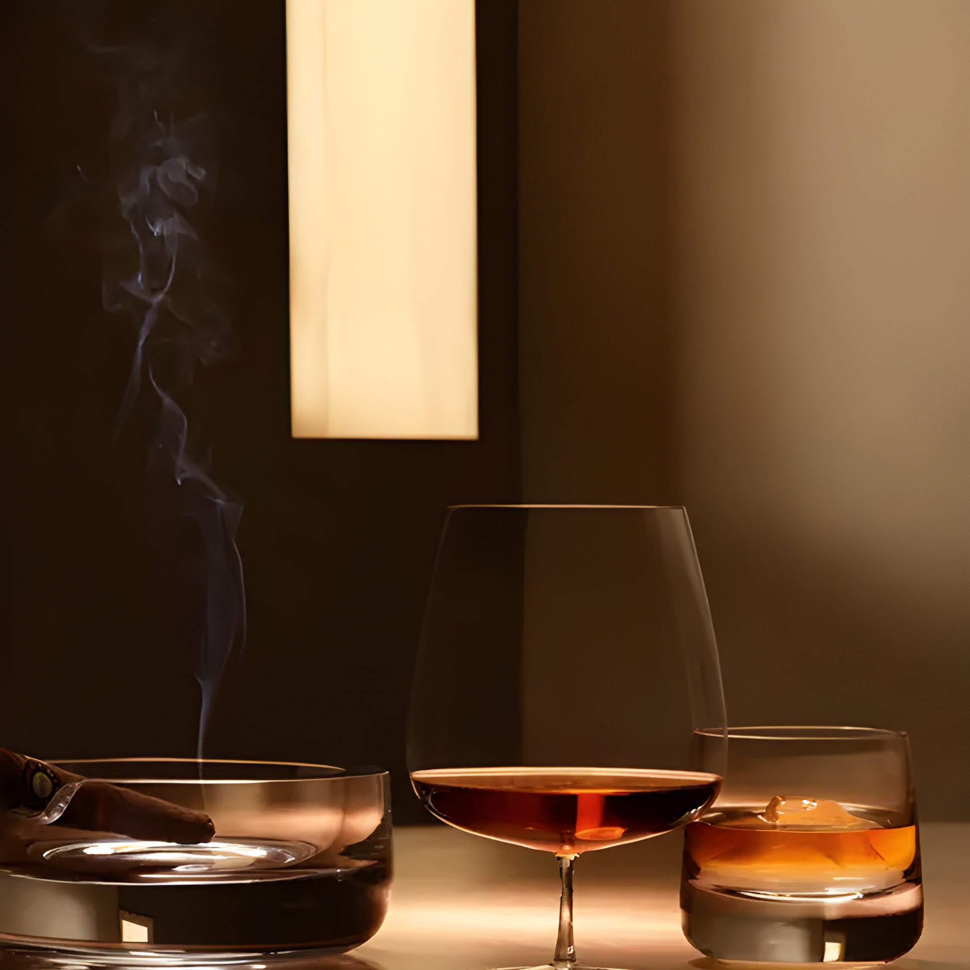 Whisky glass set with cognac, cigar smoke, and elegant bar ambiance.