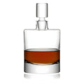 Modern crystal decanter with whiskey, featuring a cylindrical shape and stopper.
