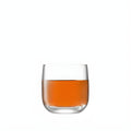 75ml clear shot glass filled with orange liquid on white background