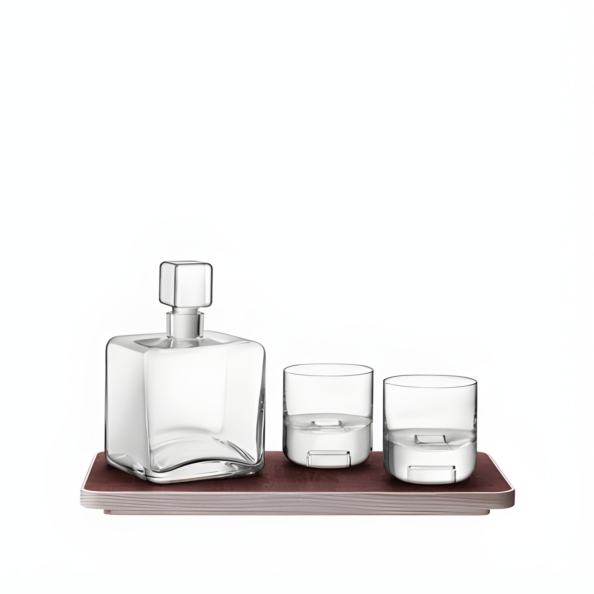 Modern whisky decanter set with glasses on an ash tray.