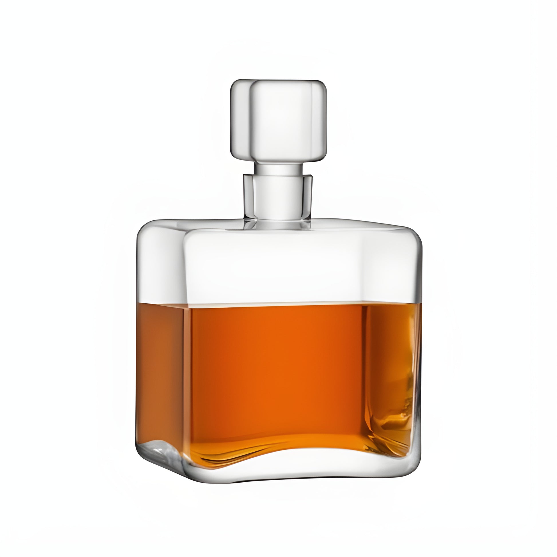 Square glass decanter filled with amber whisky on a white background.
