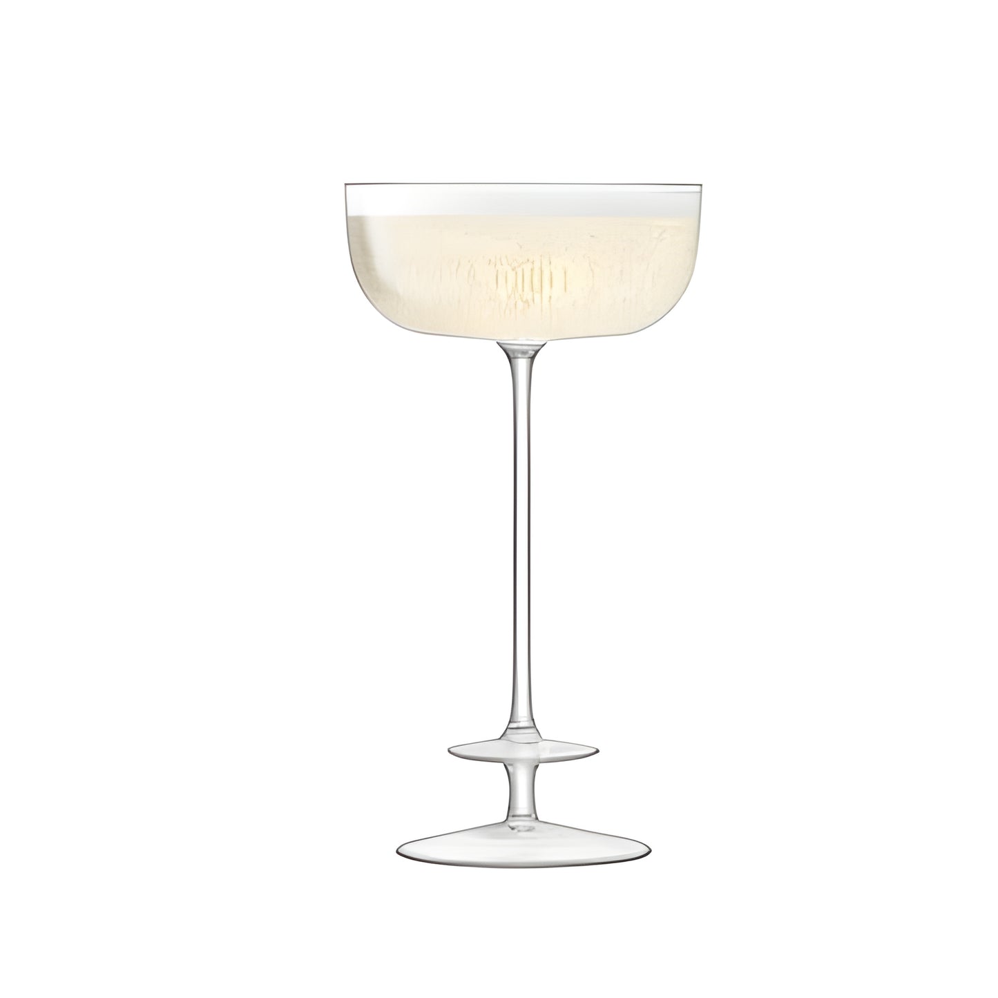 Crystal champagne saucer filled with bubbly champagne.
