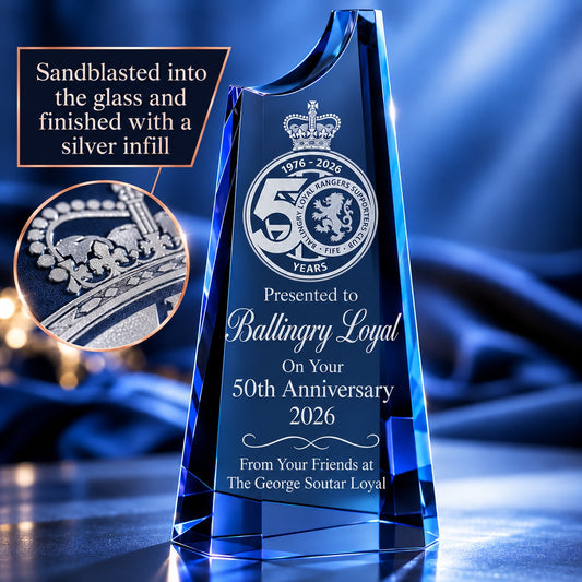 Example engraving on the Cobalt Blue Crystal Summit Award: a club crest and 50th anniversary message sandblasted into the glass with a silver infill