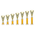 Set of gold multisport trophies in various heights with engraved cups