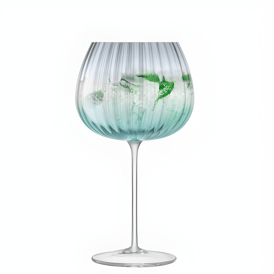 Blue striped goblet with mint garnish and gin cocktail