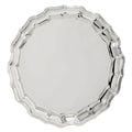 Round silver salver with decorative edges.