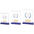 Set of glass golf trophies with blue bases and golfer silhouette.