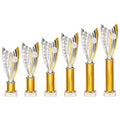 Set of six gold and silver plastic trophies with customizable bases.