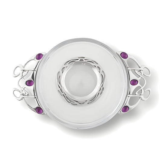 Glass and pewter Celtic quaich bowl with purple stones and ornate handles.