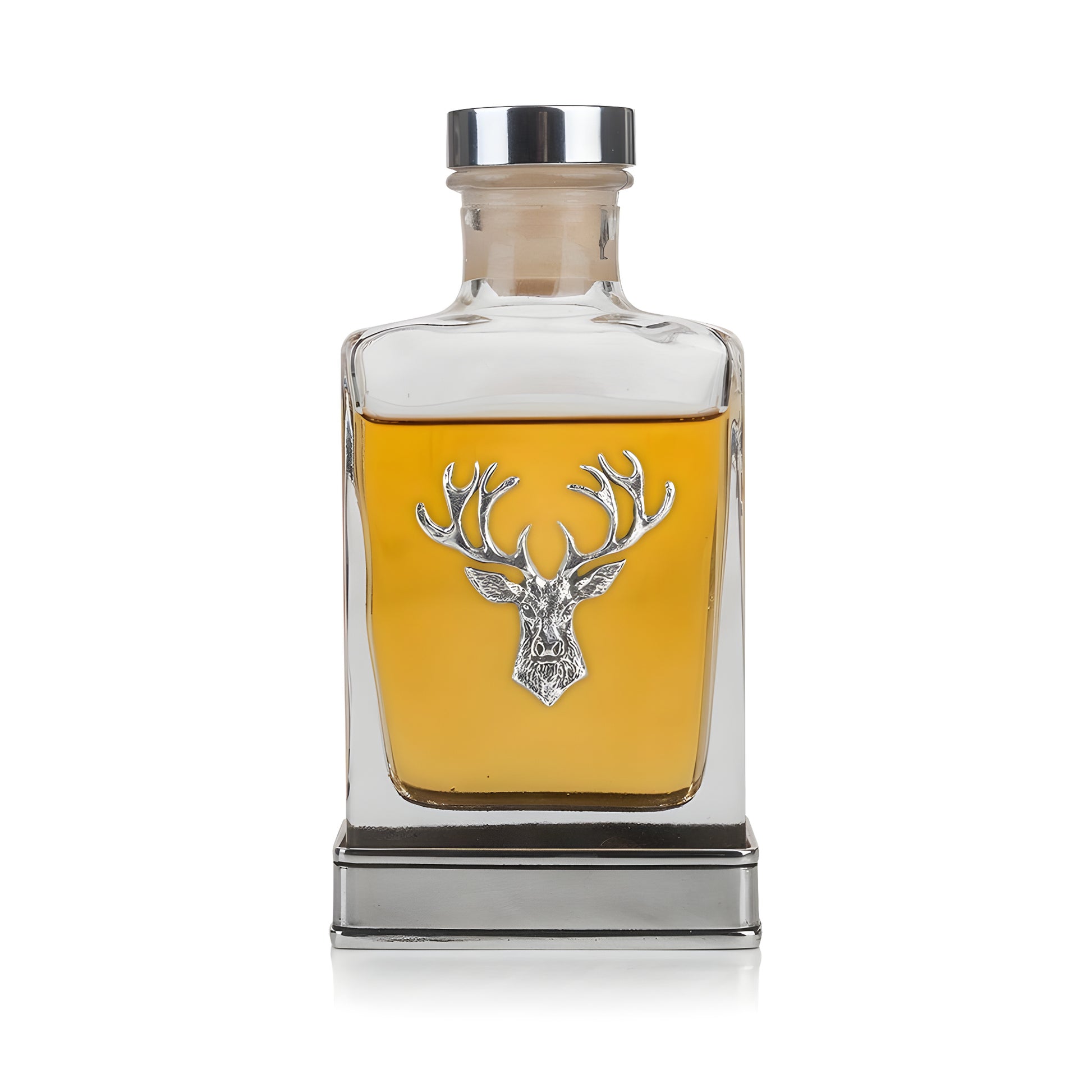 Glass pewter hip flask with engraved stag design and whiskey.