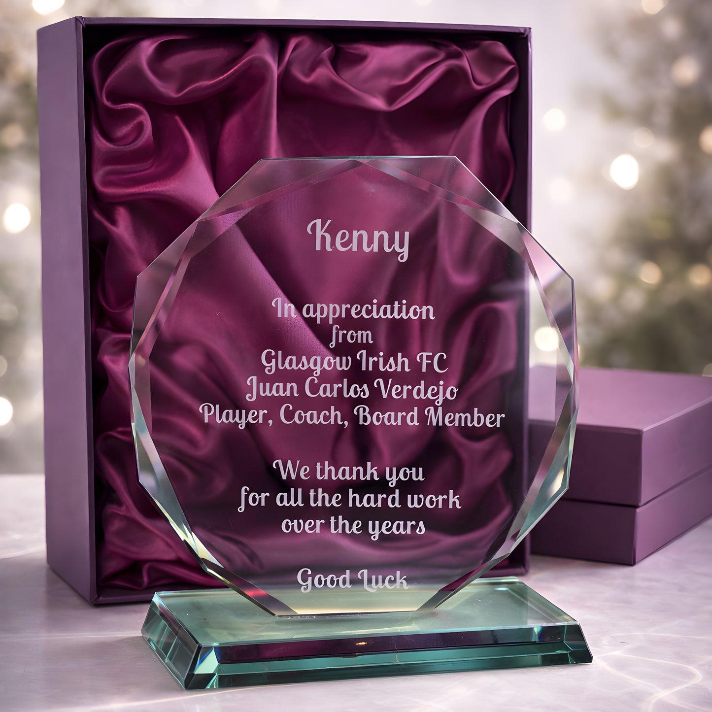 Personalized jade glass award in a purple box for coach retirement appreciation.