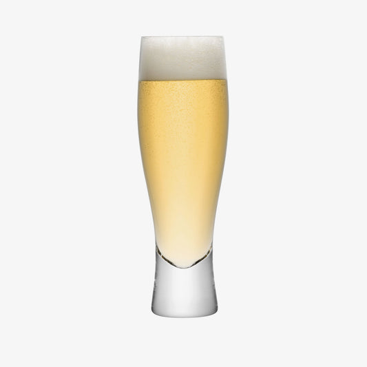 Tall pilsner glass filled with lager and foam head
