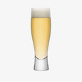 Tall pilsner glass filled with lager and foam head