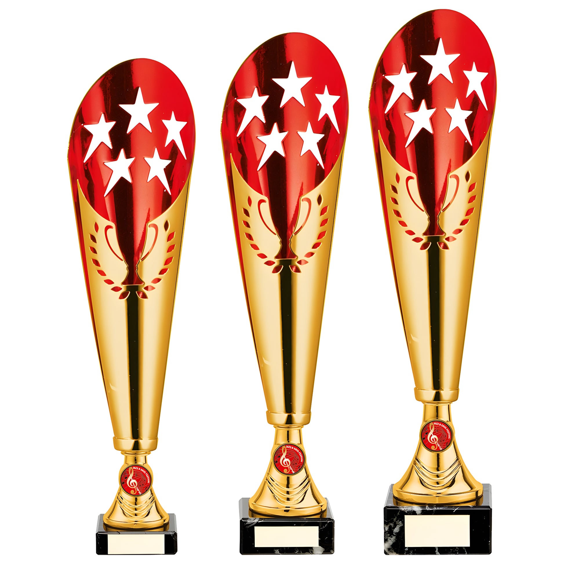 Gold and red metal trophy cups with star designs and musical emblem awards.