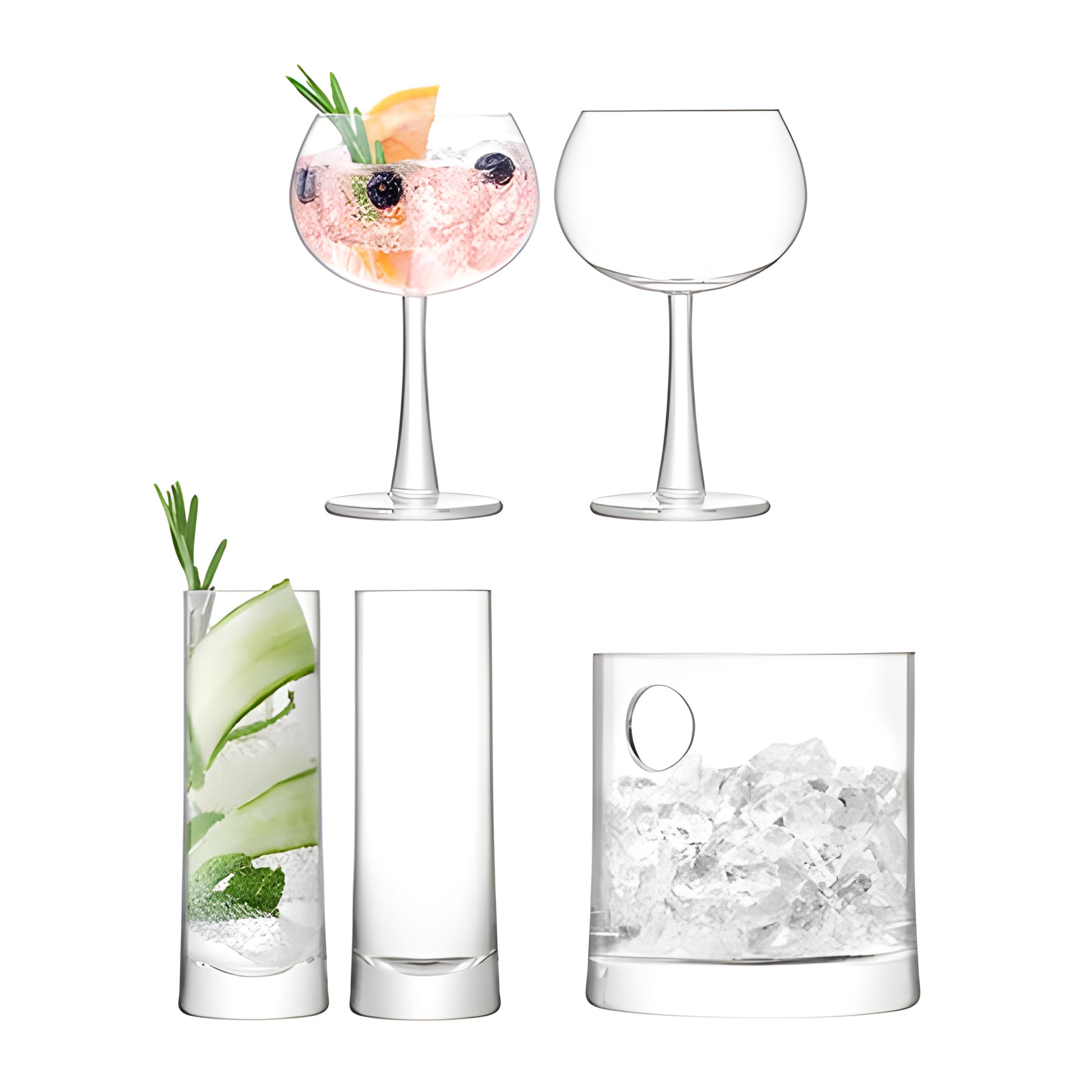 Glassware set with ice bucket and cocktail glasses for gin and tonic preparation.