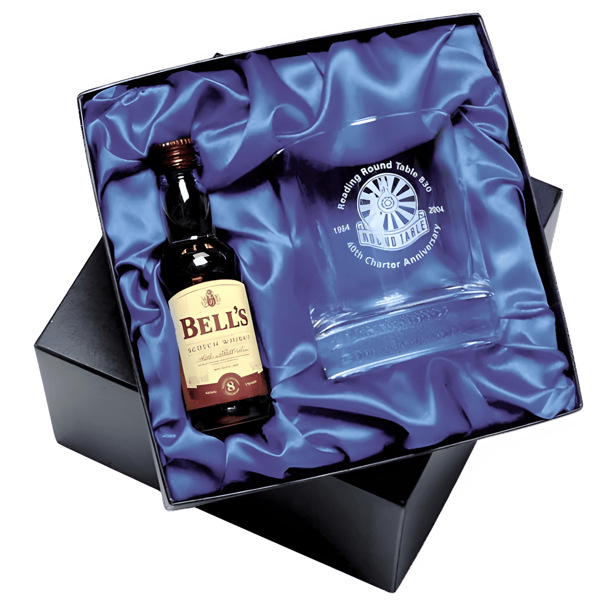 Bells Scotch whisky and glass gift set in an elegant box with blue satin lining.