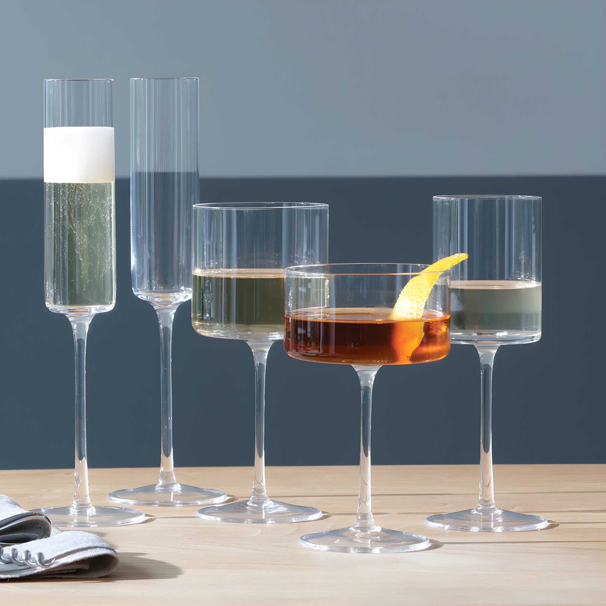 Elegant assortment of cocktails in tall glasses on a table.