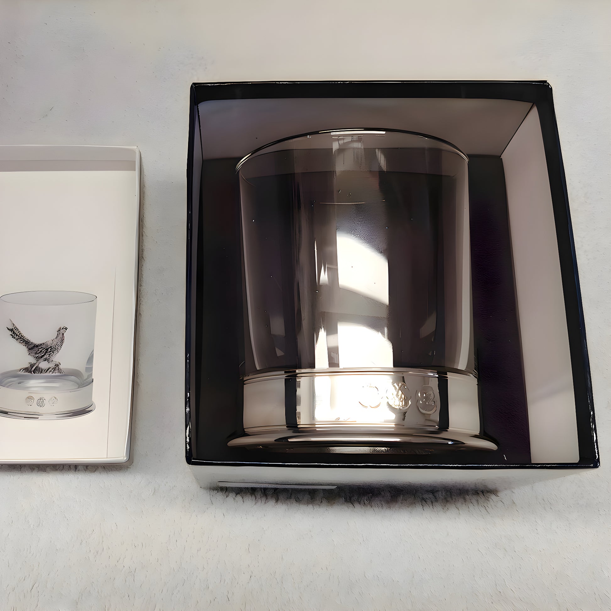 Luxury Pinder whisky glass set in black box with bird design.