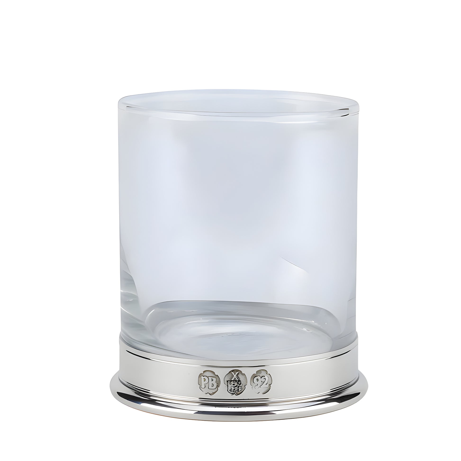 Clear whisky glass with silver base and engraved details.