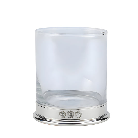 Clear whisky glass with silver base and engraved details.