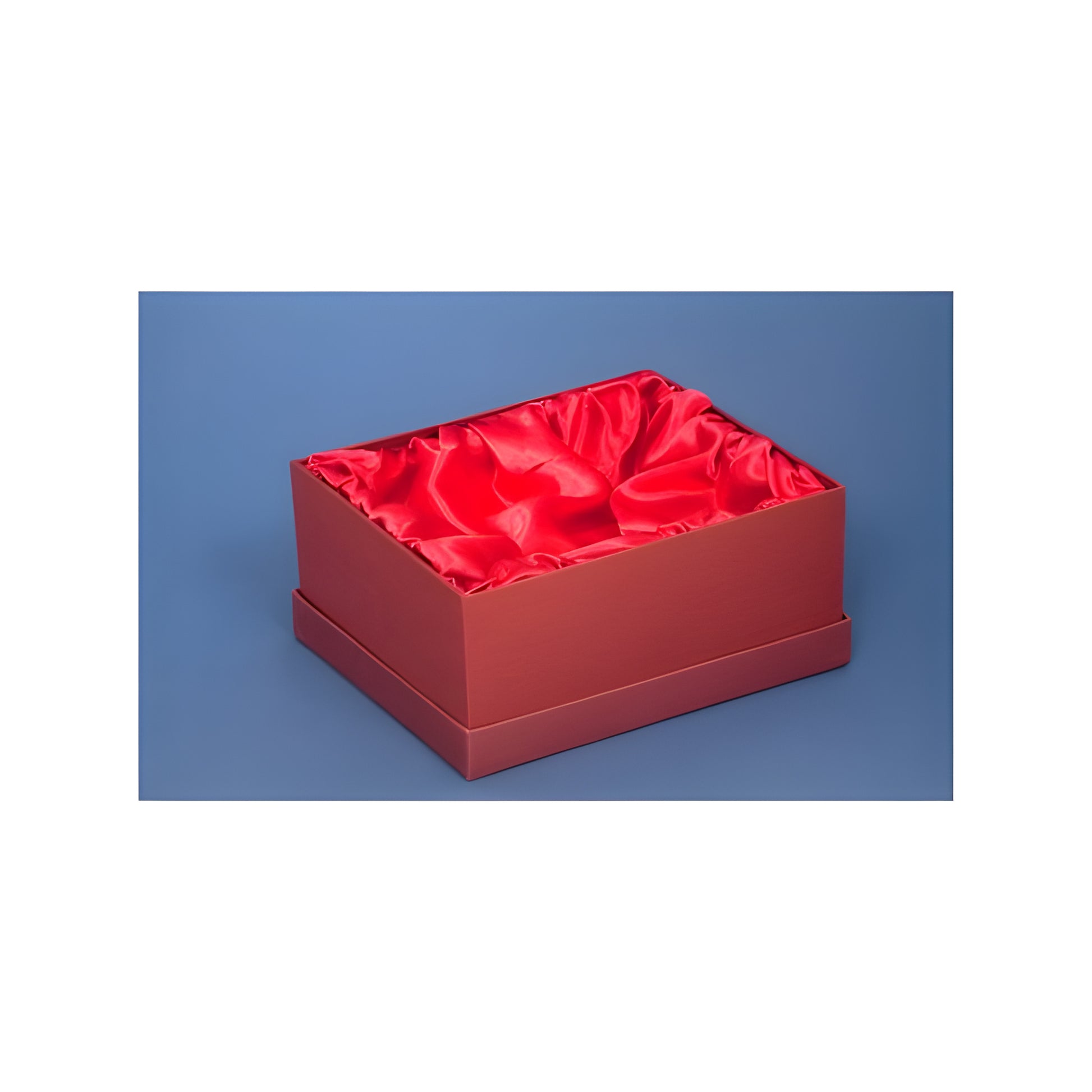 Luxury red satin-lined presentation gift box against a blue background.