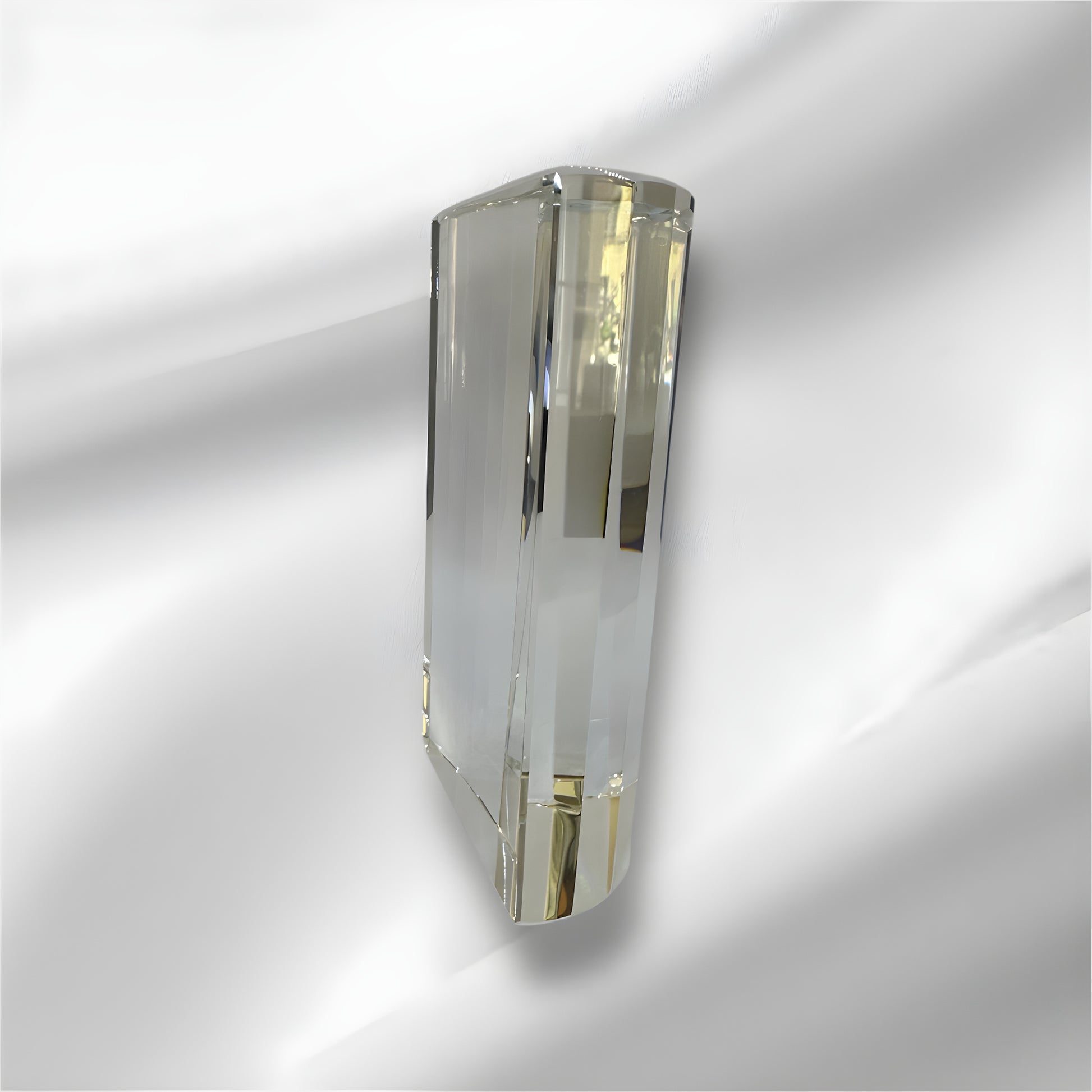 Elegant clear rectangular optic glass award on white background.