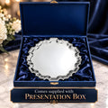 Silver-plated Chippendale salver in a blue presentation box on marble surface.
