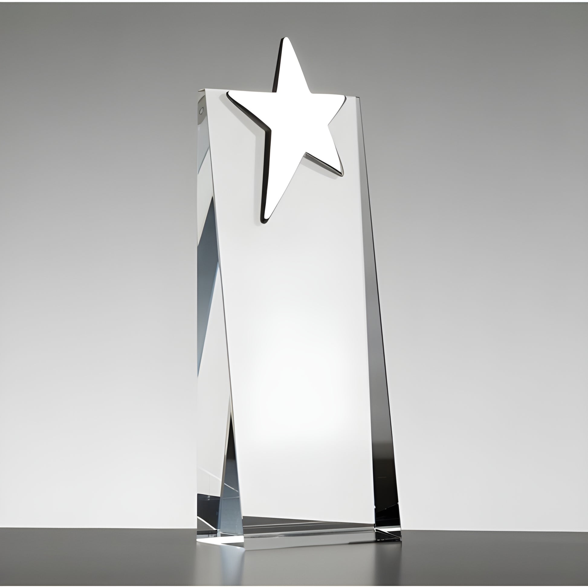 Glass award trophy with a silver star on top for a recognition ceremony.