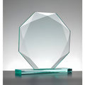 Faceted glass octagon award on base against gray background.