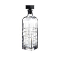 Square crystal whiskey decanter with black stopper.