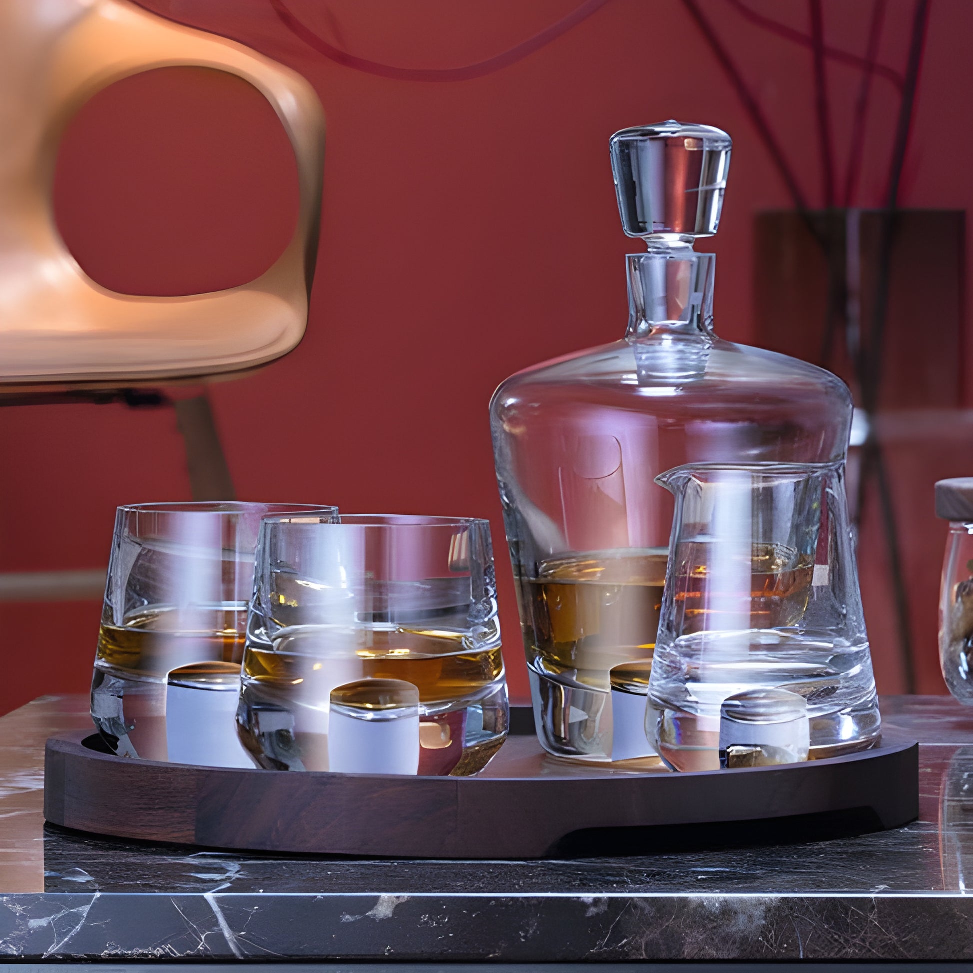 Glass decanter and whiskey glasses on a tray for a premium tasting experience.