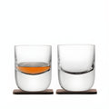 Set of 2 double-wall whisky tumblers with wooden coasters, one filled, one empty.