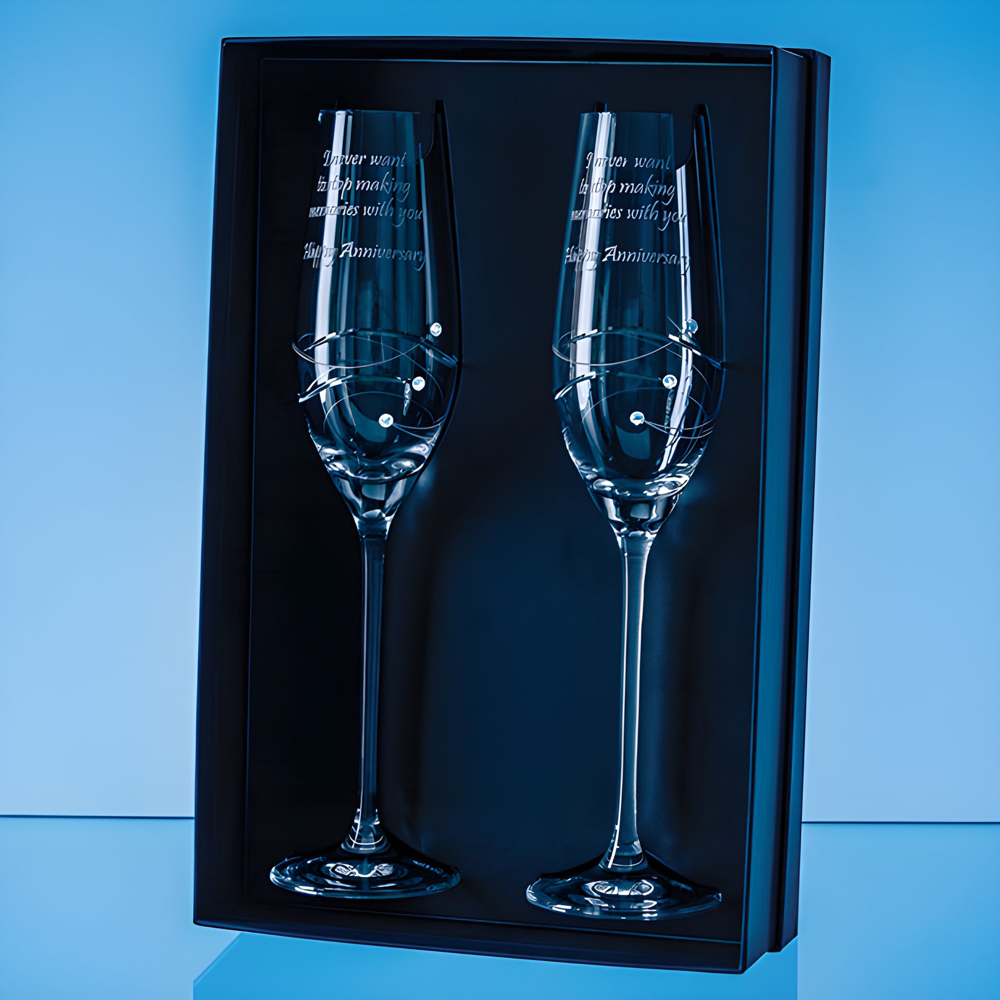 Diamante champagne flutes with spiral design in a gift box for anniversary.