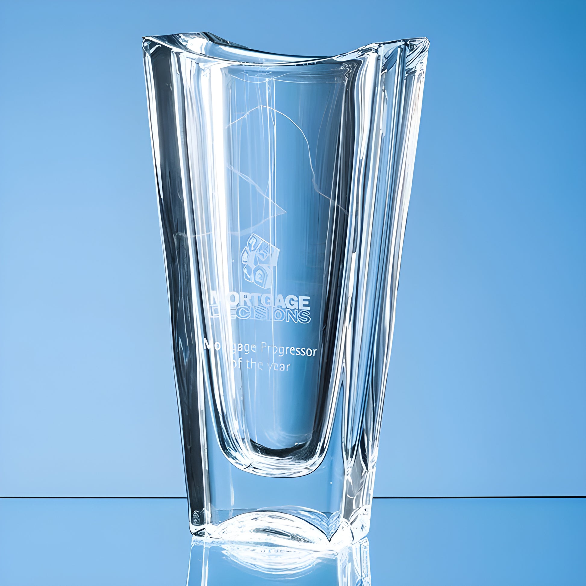 Clear glass award engraved with mortgage professor of the year text.