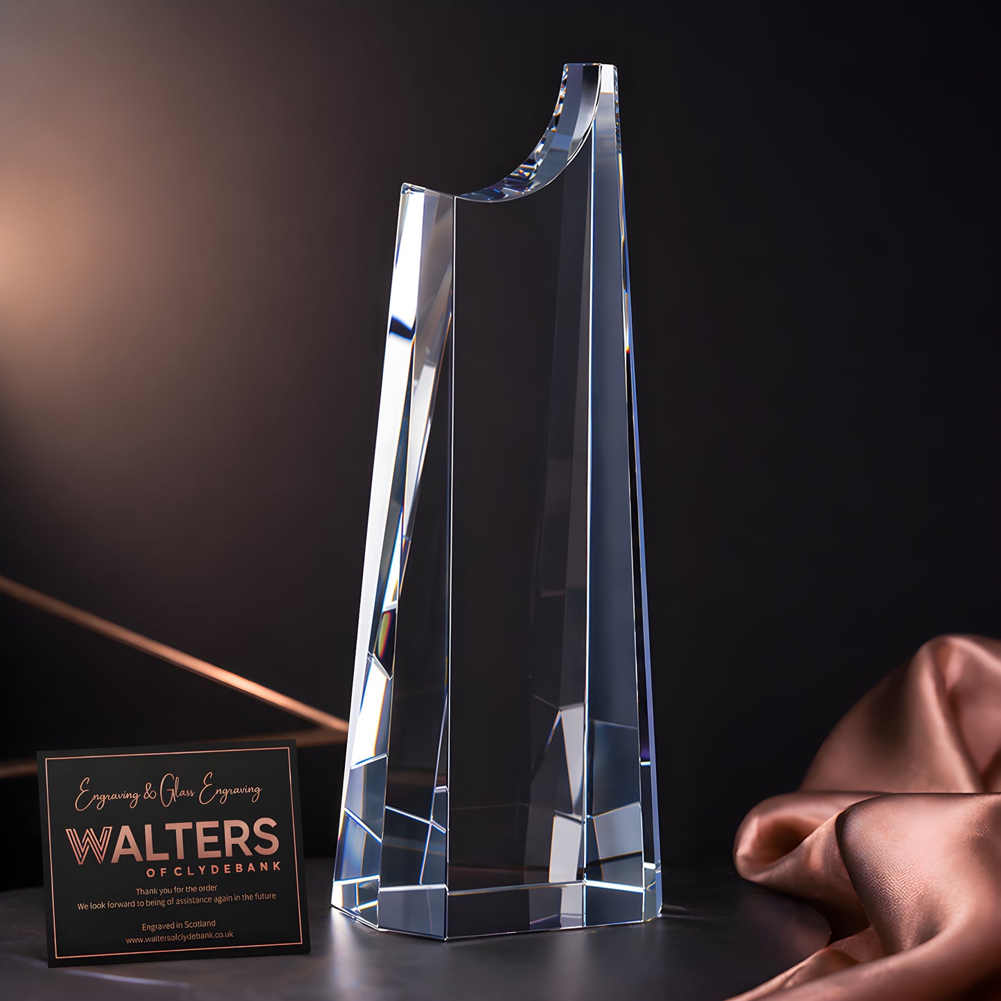 28cm optical crystal summit award with engraved plaque in elegant setting.