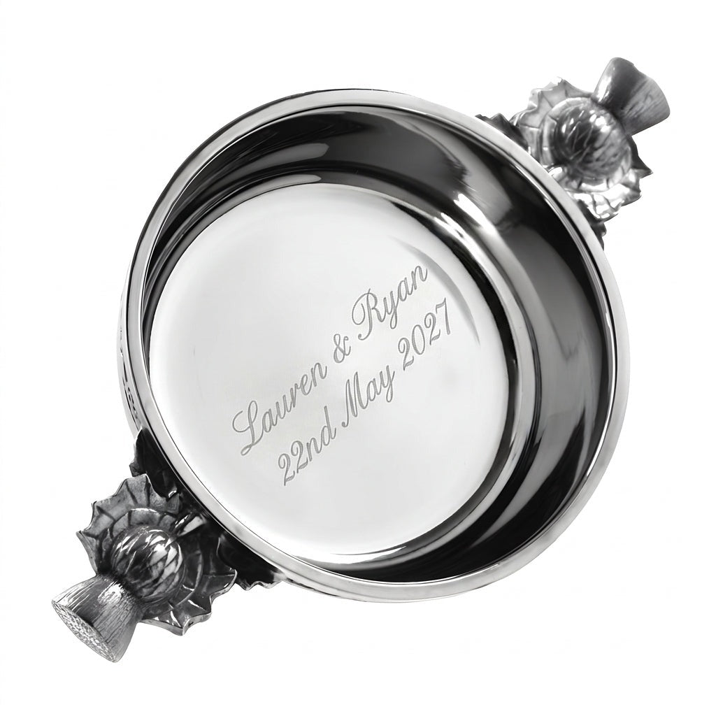 Example engraving (wedding): "Lauren & Ryan / 22nd May 2027" inside the 3" Scottish Thistle Handle Pewter Quaich Bowl