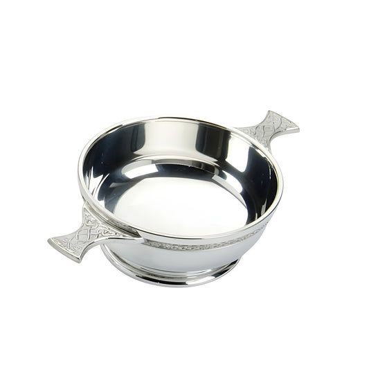 Traditional pewter quaich with Celtic design and detailed handle.