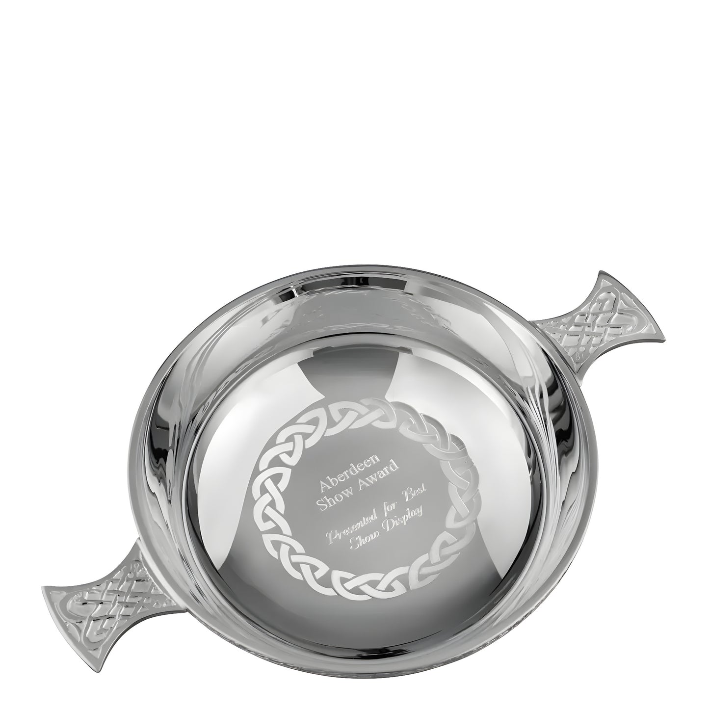 Silver Celtic quaich bowl award with intricate engravings and handles.