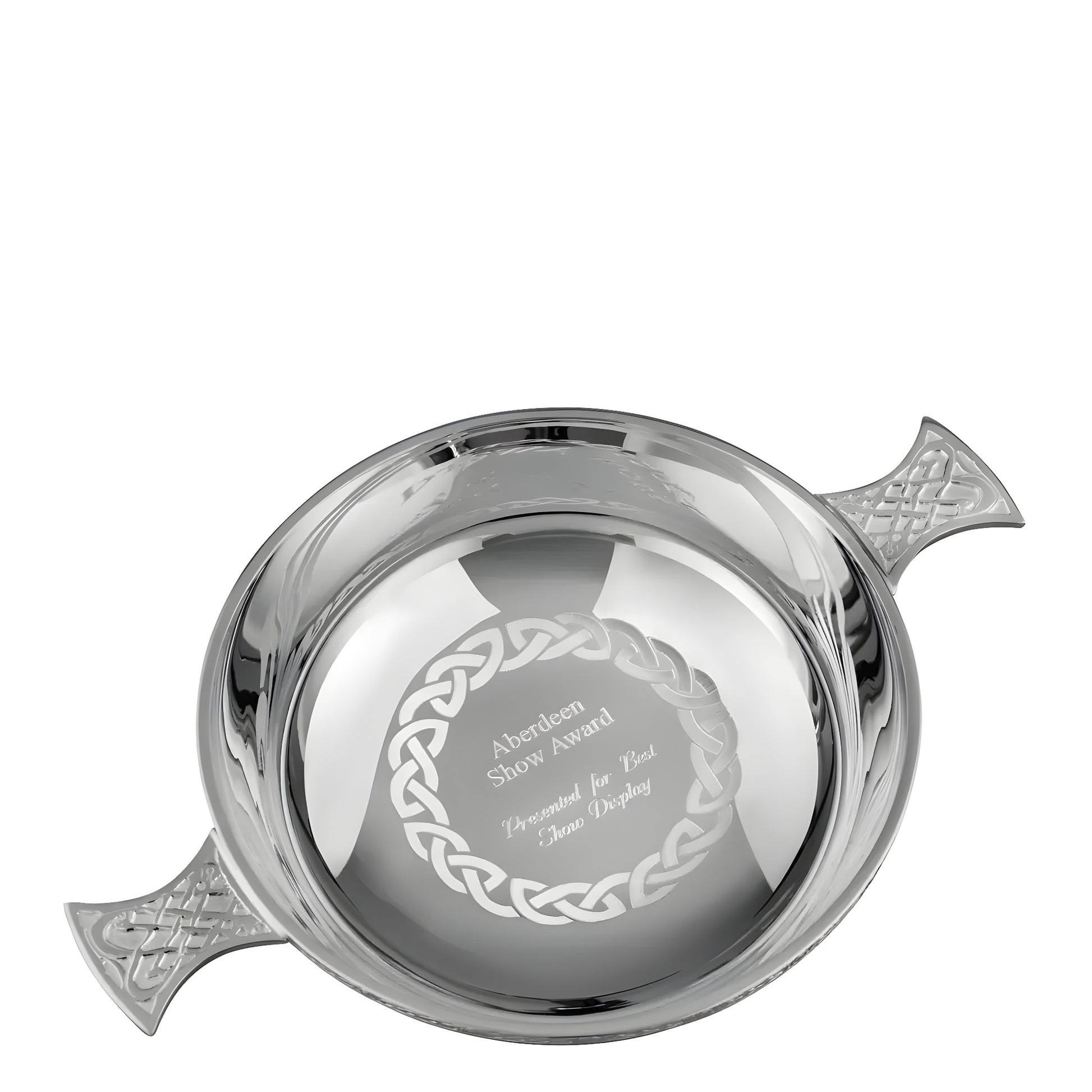 Silver Celtic quaich bowl award with intricate engravings and handles.