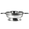 Pewter quaich bowl with Celtic knot handle and intricate design.