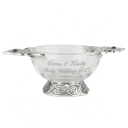 Example engraving (anniversary): "Ewan & Kirsty / Ruby Wedding 2027" on the 4" Glass & Pewter Blue Stone Celtic Quaich Bowl