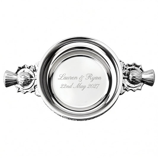 Example engraving (wedding): "Lauren & Ryan / 22nd May 2027" inside the 5" Thistle Handle Pewter Quaich Bowl