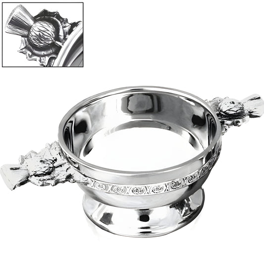 Pewter quaich with thistle handle and Celtic pattern, traditional Scottish drinking bowl.
