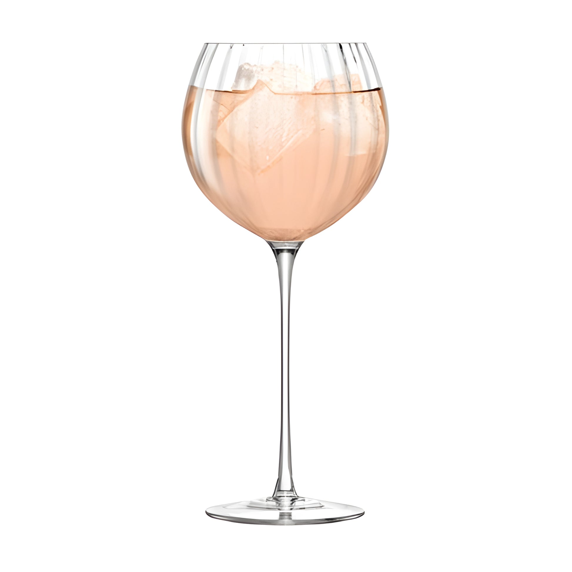 Elegant rose wine with ice cubes in a balloon glass.